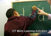 tracing letters on a blackboard in order to master correct letter formation. Tracing helps with mastery. tracing letters on a blackboard in order to master correct letter formation. Tracing helps with mastery.