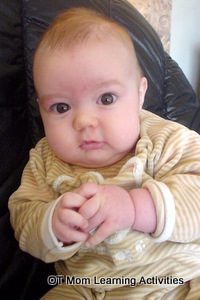 baby playing with his hands