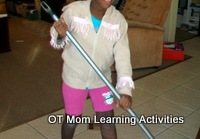 sweeping with a broom is a good gross motor activity to build kids strength and endurance
