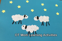 Use flower and star shaped craft hole punches to create a picture of sheep and stars for Christmas Use flower and star shaped craft hole punches to create a picture of sheep and stars for Christmas