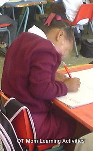 child has elevated shoulder during writing task