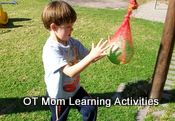 playing with a ball in a net for eye-hand coordination