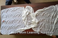 spread the scarf out on a coffee table spread the scarf out on a coffee table