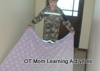 helping to fold sheets is good for bilateral coordination skills