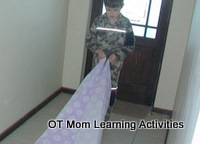 helping to fold sheets is good for bilateral integration skills