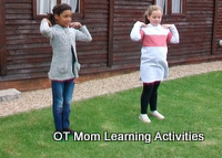 Doing the "head, shoulders, knees and toes" song for a gross motor activity