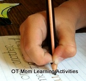 Child using a stiff pencil grip
