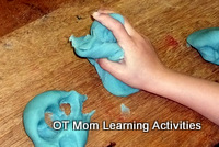 squashing playdough is a great hand strengthening activity