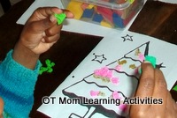 decorate a christmas picture with little balls for fine motor skills - preschool activity