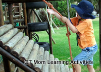 child pulling up a ramp with a rope child pulling up a ramp with a rope