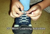 child using fine motor skills to tie shoelaces