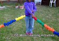 pulling hand over hand with a cooperative stretchy band in a circle is a good bilateral integration activity