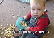 toddler eating cereal