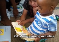 toddler exploring an interactive book