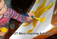 painting on a vertical surface to achieve wrist extension