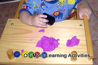toddler playing with playdough