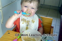 toddler self feeding with a spoon
