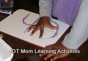 tracing over letters with a finger helps develop pre-writing skills