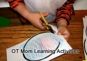 right handed child cutting incorrectly to the left of the shape