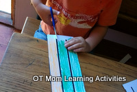 kids should not hold the paper down on the table while cutting out paper