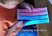 kids should hold the paper off the table while cutting out