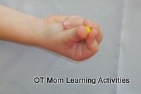 rolling small balls of plasticine