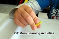 fine motor activity making plasticine sausages