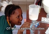 kids measuring liquids in the kitchen