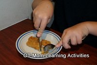 coordination to use a knife and fork together