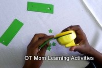 preschool Christmas activity - make paper gift tags - step 5 - use a craft punch to make a decorative hole