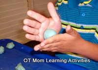rolling balls of playdough is good for bilateral skills