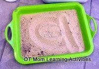 sand in a tray to practice letters